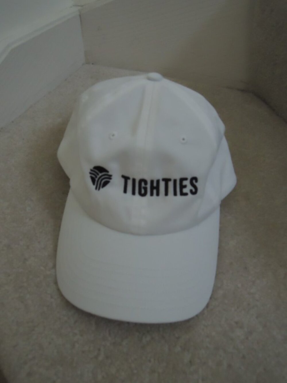 Baseball Cap Unisex White Hat w/Black Stitching "Tighties" Logo by Under Armour